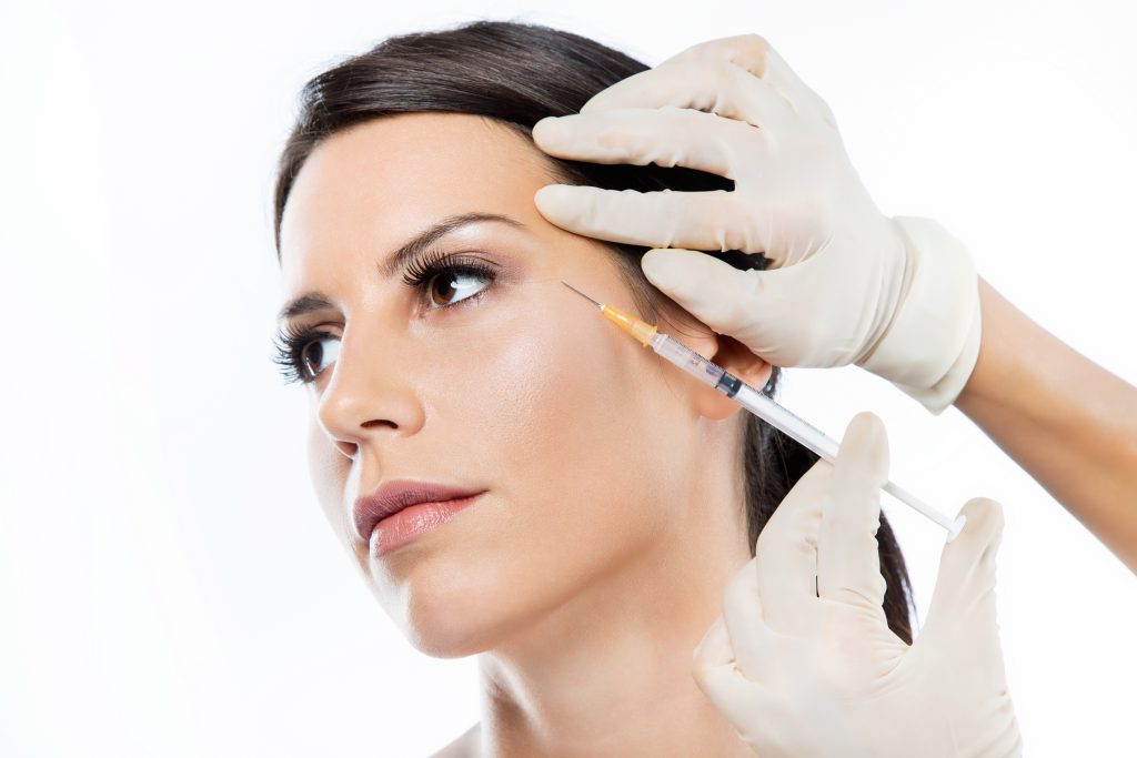 woman getting botox cosmetic injection